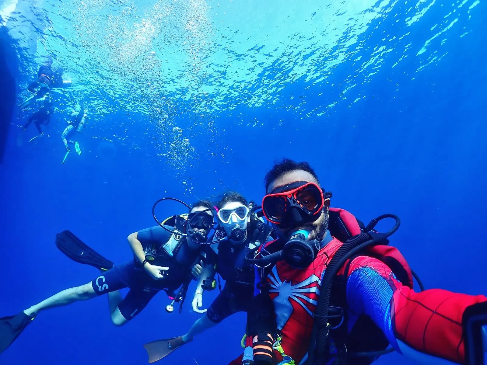 Diver checking a dive computer on a Havelock reef