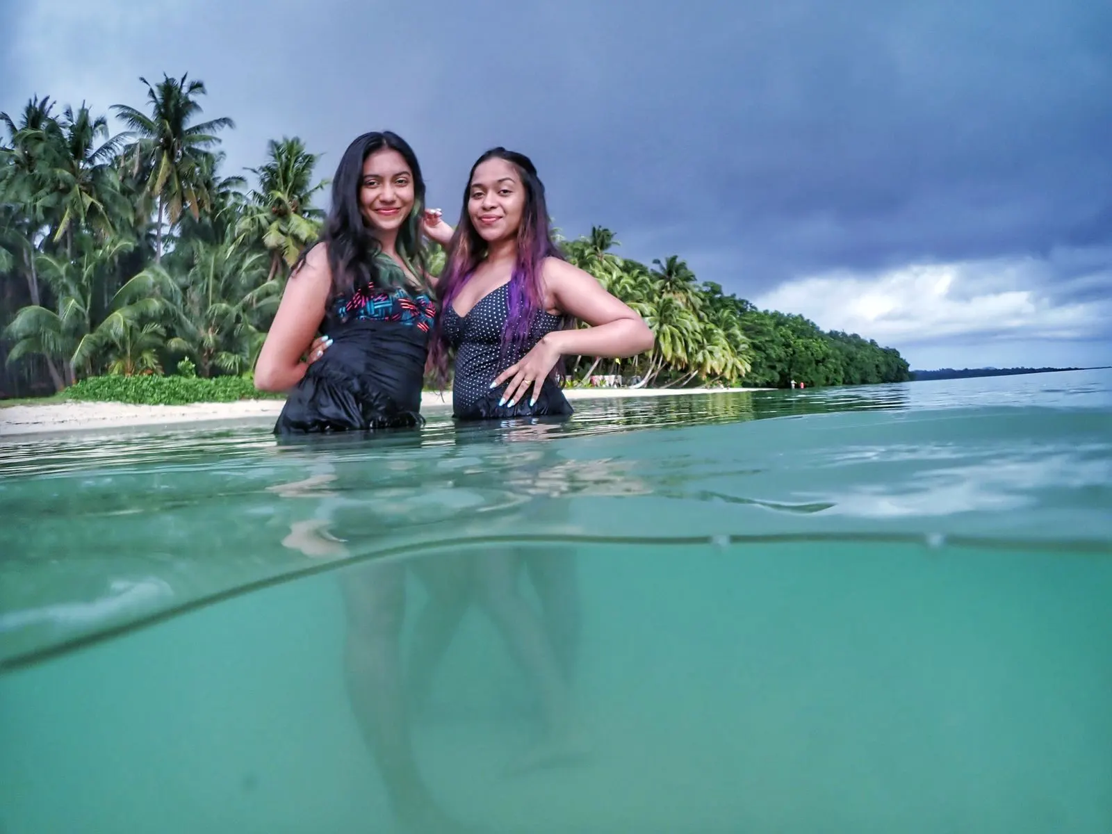 Surface Canon session — over-under portrait at a tropical shoreline