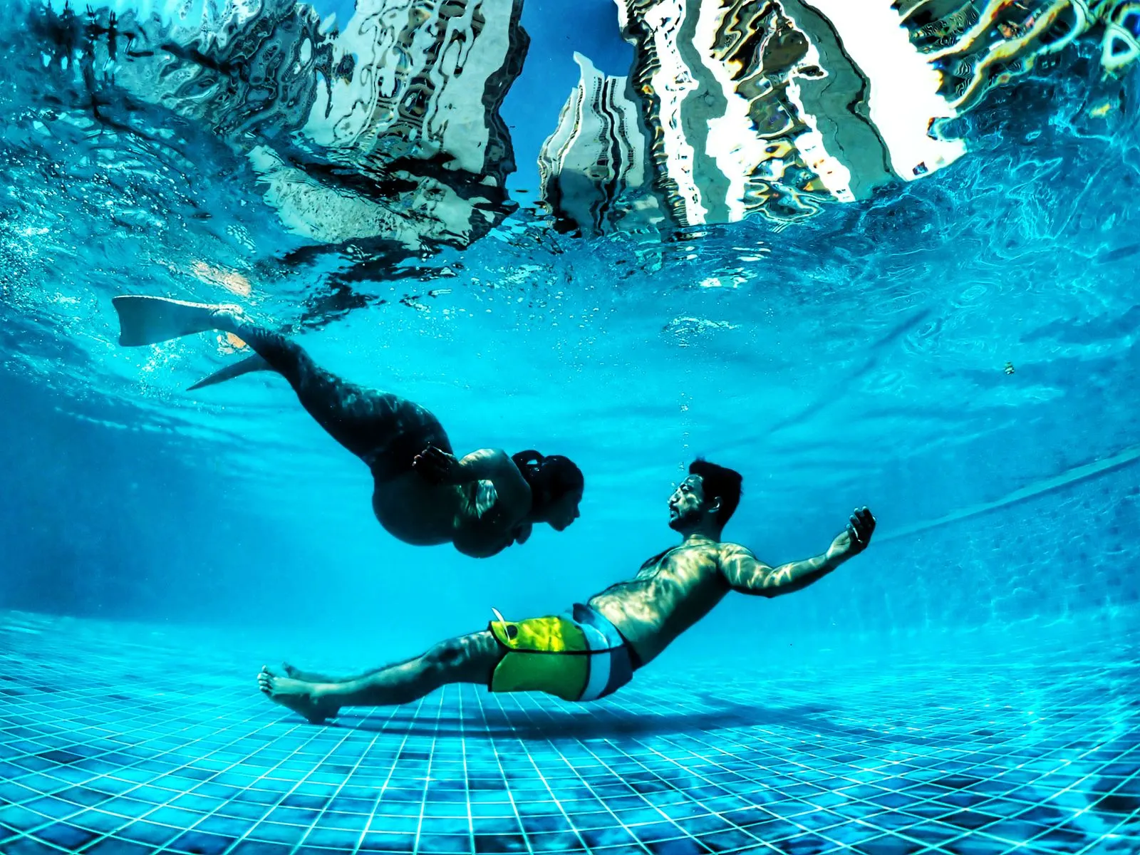 Underwater Olympus shoot — couple in clear Havelock water